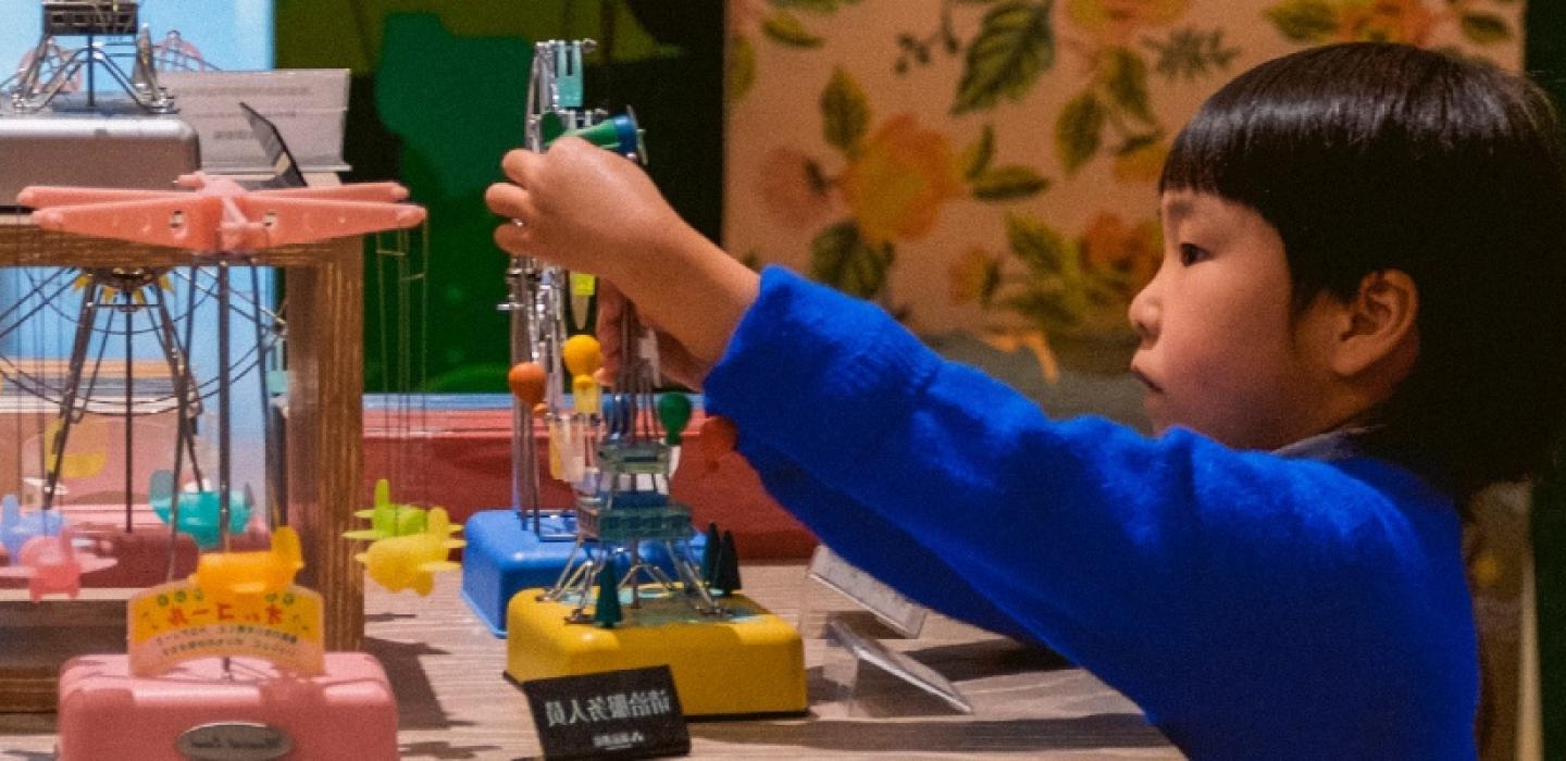 A young child playing at a table.